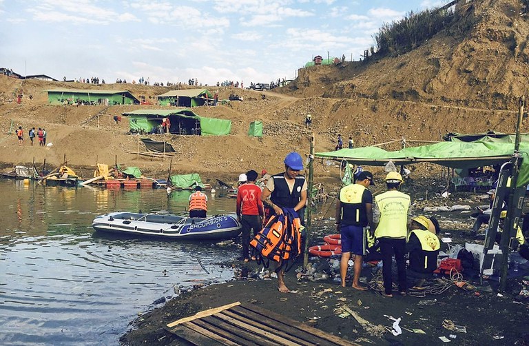Rescue workers dredge a lake in Thayar Gone village, Dec. 22, 2021. Citizen journalist